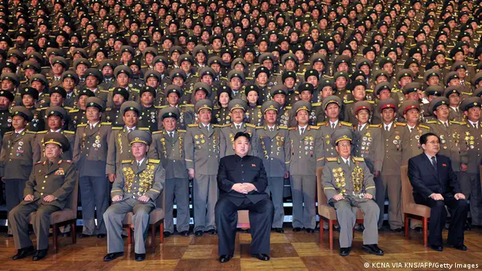 This undated picture released from North Korea's official Korean Central news Agency on November 27, 2012 shows North Korean leader Kim Jong-Un (C) during a photo session with participants in the national meeting of chiefs of branch social security stations at an undisclosed location in North Korea. AFP PHOTO / KCNA via KNS ---EDITORS NOTE--- RESTRICTED TO EDITORIAL USE - MANDATORY CREDIT AFP PHOTO / KCNA VIA KNS - NO MARKETING NO ADVERTISING CAMPAIGNS - DISTRIBUTED AS A SERVICE TO CLIENTS (Photo credit should read KCNA VIA KNS/AFP/Getty Images)