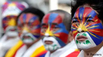 Activists with the colours of the Tibetan flag painted on their faces take part in a rally to support Tibet in Taipei March 10, 2013. Hundreds of Tibetans and their supporters in Taiwan marched the streets to commemorate the uprising in Lhasa 54 years ago against Chinese rule. REUTERS/Pichi Chuang (TAIWAN - Tags: POLITICS CIVIL UNREST ANNIVERSARY TPX IMAGES OF THE DAY)