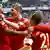 Bayern players celebrate a Jerome Boateng (left of picture) goal against Fortuna Düsseldorf