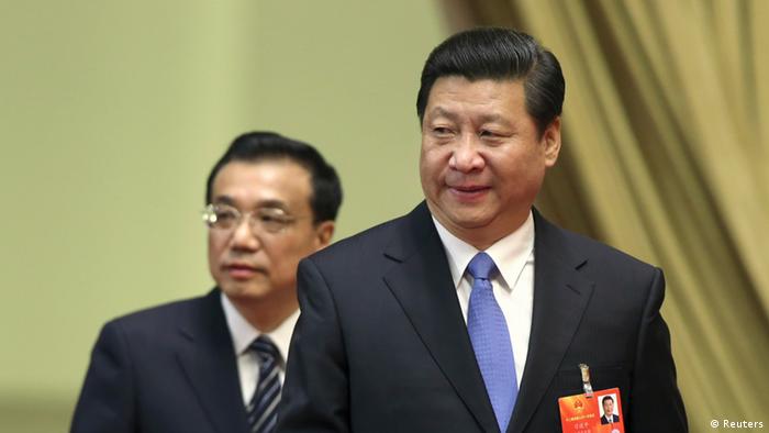 Xi Jinping (front), general secretary of the Central Committee of the Communist Party of China (CPC), and Li Keqiang, a member of the Standing Committee of the Political Bureau of the CPC Central Committee and Vice Premier, arrive at the third plenary meeting of the first session of the 12th National People's Congress (NPC) held at the Great Hall of the People in Beijing March 10, 2013. Picture taken March 10, 2013. REUTERS/China Daily (CHINA - Tags: POLITICS) CHINA OUT. NO COMMERCIAL OR EDITORIAL SALES IN CHINA