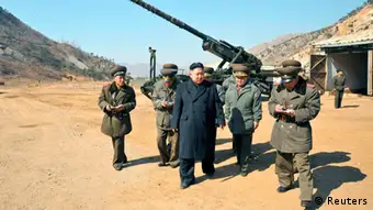 North Korean leader Kim Jong-Un (C) visits a long-range artillery sub-unit of the Korean People's Army Unit 641, whose mission is to strike Baengnyeong Island of South Korea in the western sector of the front line March 11, 2013 in this picture released by the North's official KCNA news agency in Pyongyang March 12, 2013. South Korea and U.S. forces are conducting large-scale military drills, while the North is also gearing up for a massive military exercise. North Korea has accused the U.S. of using the military drills in the South as a launch pad for a nuclear war and has said to scrap the armistice with the U.S. that ended the 1950-53 Korean War. REUTERS/KCNA (NORTH KOREA - Tags: POLITICS MILITARY CIVIL UNREST) ATTENTION EDITORS - THIS PICTURE WAS PROVIDED BY A THIRD PARTY. REUTERS IS UNABLE TO INDEPENDENTLY VERIFY THE AUTHENTICITY, CONTENT, LOCATION OR DATE OF THIS IMAGE. THIS PICTURE IS DISTRIBUTED EXACTLY AS RECEIVED BY REUTERS, AS A SERVICE TO CLIENTS. QUALITY FROM SOURCE. NO THIRD PARTY SALES. NOT FOR USE BY REUTERS THIRD PARTY DISTRIBUTORS ATTENTION EDITORS - THIS PICTURE WAS PROVIDED BY A THIRD PARTY. REUTERS IS UNABLE TO INDEPENDENTLY VERIFY THE AUTHENTICITY, CONTENT, LOCATION OR DATE OF THIS IMAGE. THIS PICTURE IS DISTRIBUTED EXACTLY AS RECEIVED BY REUTERS, AS A SERVICE TO CLIENTS. QUALITY FROM SOURCE. NO THIRD PARTY SALES. NOT FOR USE BY REUTERS THIRD PARTY DISTRIBUTORS