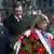 Serbian Prime Minister Ivica Dacic (L) and Deputy Prime Minister Aleksandar Vucic (2nd L) arrive to lay a wreath in a memory of late Prime Minister Zoran Djindjic in front of Serbian government building where he was assassinated ten years ago in Belgrade March 12, 2013. Laying flowers where a sniper struck, the political heirs of Serb strongman Slobodan Milosevic paid tribute on Tuesday to the murdered reformer who led his overthrow and plotted the pro-Western path that they now follow. It was a gesture loaded with symbolism for Serbia 10 years to the day since the murder of Djindjic, with thousands of supporters expected to march through the capital, Belgrade, in his honour. REUTERS/Djordje Kojadinovic (SERBIA - Tags: ANNIVERSARY POLITICS)