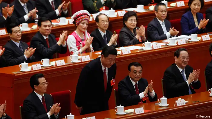 China's newly-elected President Xi Jinping bows during the fourth plenary meeting of the National People's Congress (NPC) at the Great Hall of the People in Beijing, March 14, 2013. China's parliament formally elected heir-in-waiting Xi as the country's new president on Thursday, succeeding Hu Jintao, putting the final seal of approval on a generational transition of power. REUTERS/Barry Huang (CHINA - Tags: POLITICS)