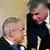 Israeli Prime Minister Benjamin Netanyahu (L) turns around as new Knesset member Yair Lapid shakes hands with the Israeli leader during a swearing-in ceremony in the Knesset (Photo: EPA/JIM HOLLANDER)