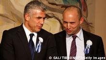 Israeli politician Yair Lapid (L), leader of the Yesh Atid party, speaks to Naftali Bennett, head of the Israeli hardline national religious party the Jewish Home during a reception marking the opening of the 19th Knesset (Israeli parliament) on February 5, 2013 in Jerusalem. AFP PHOTO/GALI TIBBON (Photo credit should read GALI TIBBON/AFP/Getty Images)