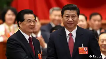 Hu Jintao (L) shakes hands with China's newly elected President and chairman of the Central Military Commission Xi Jinping during the fourth plenary meeting of the first session of the 12th National People's Congress (NPC) in Beijing, March 14, 2013. REUTERS/China Daily (CHINA - Tags: POLITICS) CHINA OUT. NO COMMERCIAL OR EDITORIAL SALES IN CHINA