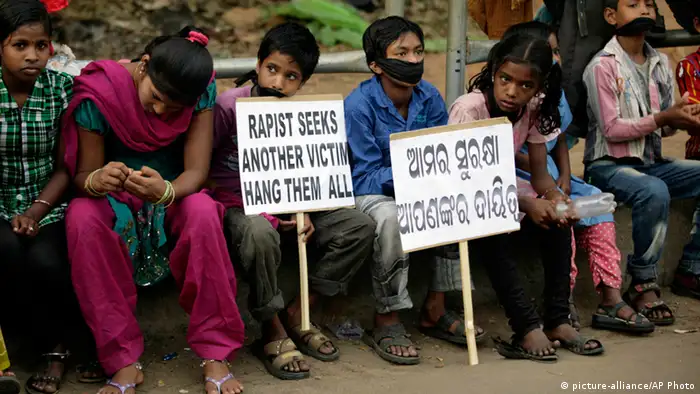 Indian children participate in a protest against child abuse and rising crimes against women, in Bhubaneswar, India, Saturday, March 16, 2013. India has seen outrage and widespread protests against rape and attacks on women and minors since a fatal gang-rape of a young woman in December on a moving bus in New Delhi, the capital. In the most recent case, a Swiss woman who was on a cycling trip in central India with her husband has been gang-raped by eight men, police said. Placard reads our safety is your responsibility. (AP Photo/Biswaranjan Rout)