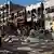 Überreste einer Autobombe und zerstörte Häuser (Foto: Reuters)