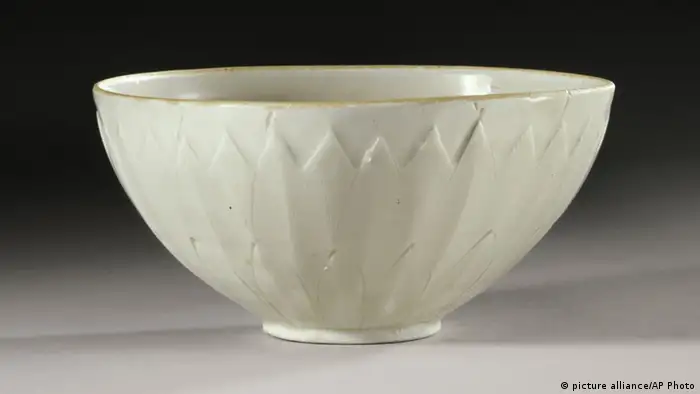 This undated photo provided by Sothebys Auction House in New York shows a 1,000-year-old Chinese Ding bowl from the Northern Song Dynasty. The bowl, purchased from a tag sale for no more than three dollars, was sold by Sothebys for more than $2.22 million during the opening session of Sotheby's fine Chinese ceramics and works of art auction Tuesday, March 19, 2013 in New York. (AP Photo/Sothebys Auction House)