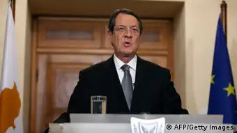 Cypriot President Nicos Anastasiades addresses the nation in a live televised speech in Nicosia on March 25, 2013 after having flown home from Brussels where he negotiated a bailout deal. Anastasiades admitted the eurozone bailout deal he struck in Brussels was painful but said Cyprus could now make a fresh start after having come a 'breath away' from collapse. AFP PHOTO / POOL / PETROS KARADJIAS (Photo credit should read PETROS KARADJIAS/AFP/Getty Images)