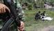 A Thai soldier guards as his comrades inspect a dead bodies of suspected insurgents after a clash with marines at a Navy base in Narathiwat province, southern Thailand, 13 February 2013. (c) dpa - Bildfunk+++ A Thai soldier guards as his comrades inspect a dead bodies of suspected insurgents after a clash with marines at a Navy base in Narathiwat province, southern Thailand, 13 February 2013. (c) dpa - Bildfunk+++