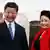 Chinese President Xi Jinping (L) and First Lady Peng Liyuan bid farewell as they board their plane to depart from the Julius Nyerere International Airport in Dar es Salaam, Tanzania, March 25, 2013. China's new president told Africans on Monday he wanted a relationship of equals that would help the continent develop, responding to concerns that Beijing is only interested in shipping out its raw materials. REUTERS/Thomas Mukoya (TANZANIA - Tags: POLITICS TPX IMAGES OF THE DAY)