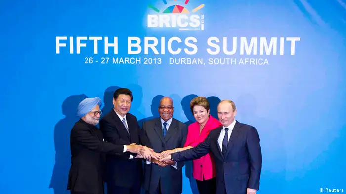 (L-R) Indian Prime Minister Manmohan Singh, Chinese President Xi Jinping, South African President Jacob Zuma, Brazilian President Dilma Rousseff and Russian President Vladimir Putin pose for a family photograph during the fifth BRICS Summit in Durban, March 27, 2013. REUTERS/Rogan Ward (SOUTH AFRICA - Tags: POLITICS BUSINESS)