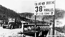 A jeep of the United Nations forces withdrawing from Pyongyang, the North Korean capital, recrosses the 38th parallel in December 1950. The Korean War between armies from North Korea and from South Korea lasted from June 25, 1950 to July 27, 1953. The north was helped by People's Rupublic of China and the USSR. The south was helped by countries in the United Nations, especially by the United States. AFP PHOTO (Photo credit should read -/AFP/Getty Images)