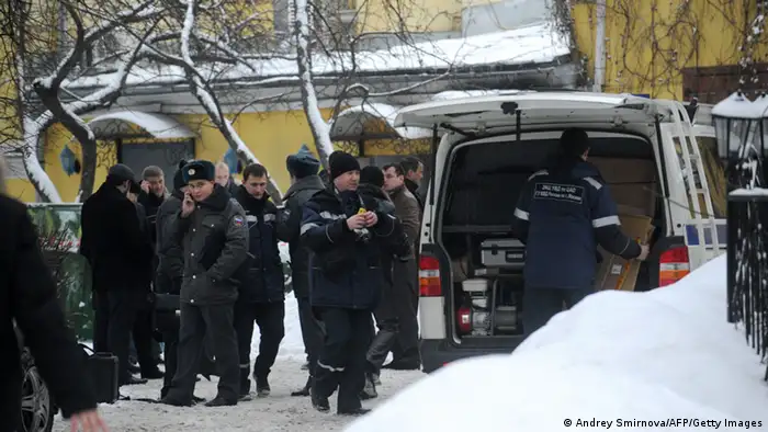 Police officers and investigators crowd at the site of a killing of Aslan Usoyan outside the Karetny Dvor restaurant in central Moscow, on January 16, 2013. Aslan Usoyan believed to be one of Russia's biggest mafia bosses was shot dead today in the centre of Moscow as he was leaving a restaurant after lunch, the interior ministry said. AFP PHOTO / ANDREY SMIRNOV (Photo credit should read ANDREY SMIRNOV/AFP/Getty Images)