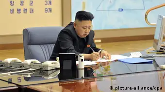 epa03644057 A picture released by the North Korean Central News Agency (KCNA) on 29 March 2013 shows North Korean leader Kim Jong-un convening an urgent operation meeting at 0:30 am on 29 March 2013 at an undisclosed location, in which he ordered strategic rocket forces to be on standby to strike US and South Korean targets at any time. Kim's order followed two US stealth bombers' first-ever drill over the Korean Peninsula the previous day. The North berated the drill as US hostility against it. EPA/KCNA SOUTH KOREA OUT NO SALES