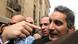 Bassem Youssef (R), the country's best-known satirist, gestures to journalists and activists as he arrives at the high court to appear at the prosecutor's office in Cairo March 31, 2013. Egypt's prosecutor-general on Saturday ordered the arrest of Youssef for making fun of Islamist President Mohamed Mursi and his Muslim Brotherhood. REUTERS/Mohamed Abd El Ghany (EGYPT - Tags: POLITICS CRIME LAW SOCIETY) Bassem Youssef (R), the country's best-known satirist, gestures to journalists and activists as he arrives at the high court to appear at the prosecutor's office in Cairo March 31, 2013. Egypt's prosecutor-general on Saturday ordered the arrest of Youssef for making fun of Islamist President Mohamed Mursi and his Muslim Brotherhood. REUTERS/Mohamed Abd El Ghany (EGYPT - Tags: POLITICS CRIME LAW SOCIETY)