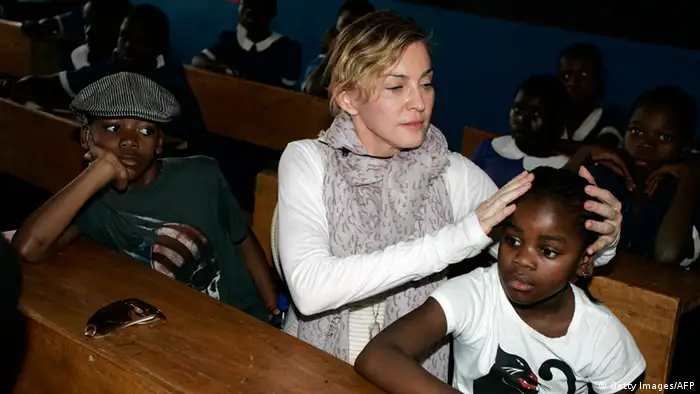 Madonna touches young Malawi boy's head 