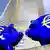 Two blue piggy banks with euro symbols on them Photo: picture-alliance/dpa