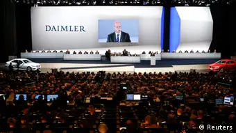 Daimler CEO Dieter Zetsche addresses the audience at the Daimler annual shareholder meeting in Berlin April 10, 2013. German premium carmaker Daimler is likely to cut its profit expectations for the year, after it said on Wednesday that its core European markets continue to weaken. Daimler has fallen far behind German rivals BMW and Audi due to deep-seated problems in China, and the latest profit warning is another dent in the credibility of Chief Executive Dieter Zetsche, whose contract extension in February nearly ended in a boardroom coup. REUTERS/Fabrizio Bensch (GERMANY - Tags: TRANSPORT BUSINESS)