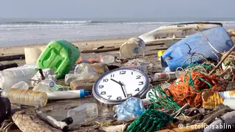 pollution; environmental damage; garbage; waste; rubbish; fishing net; toxic substance; beach; sable; landfill; water; water pollution; disaster; dirty; plastic; bottle; messy; bag; coastline; unhygienic; careless; fishing; environment; landscape; nature; ocean; sea; sadness; impact; recycling; global warming; concepts; symbol; time; clock; urgency; problems; deadline; ideas; countdown; clock face; running time; cleanup; blue sky; nobody; vertical; photography Schlagworte .Umwelt , Strand , Unrat , Kanister , Ostfriesland , Müll , Insel , .Strand , .Abfälle , .Unrat , Umwelt , Umwel , .Meere , .Strandgut , Meer , .Küste