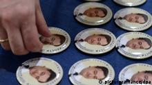 ITAR-TASS: MOSCOW, RUSSIA. APRIL 8, 2013. Pins bearing portraits of Sergei Magnitsky, an accountant and auditor at the British investment company Hermitage Capital Management. Sergei Magnitsky died in custody in November 2009 at the age of 37. The Moscow Sakharov Cen¬ter marks the 41st birth¬day of the late lawyer. (Photo ITAR-TASS/ Stanislav Krasilnikov)