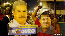 Supporters of Venezuelan presidential candidate Nicolas Maduro celebrate with masks of Maduro (L) and late Venezuelan President Hugo Chavez, after the official results gave Maduro a victory in the balloting, in Caracas April 14, 2013. Maduro, a former bus driver who became Hugo Chavez's protege, narrowly won Venezuela's presidential election on Sunday, the electoral authority said, allowing him to continue the socialist policies of his late predecessor. REUTERS/Edwin Montilva (VENEZUELA - Tags: ELECTIONS POLITICS)