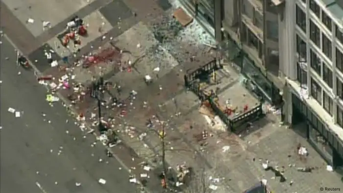 Still image taken from video courtesy of NBC shows the scene of an explosion at the Boston Marathon, April 15, 2013. Two explosions struck the marathon as runners crossed the finish line on Monday, witnesses said, injuring an unknown number of people on what is ordinarily a festive day in the city. REUTERS/NBC/Handout (UNITED STATES - Tags: CIVIL UNREST SPORT ATHLETICS) FOR EDITORIAL USE ONLY. NOT FOR SALE FOR MARKETING OR ADVERTISING CAMPAIGNS. THIS IMAGE HAS BEEN SUPPLIED BY A THIRD PARTY. IT IS DISTRIBUTED, EXACTLY AS RECEIVED BY REUTERS, AS A SERVICE TO CLIENTS. NO ARCHIVES. UNITED STATES OUT. NO COMMERCIAL OR EDITORIAL SALES IN UNITED STATES. NO ONLINE USE. NOT FOR SALE FOR INTERNET DISPLAY