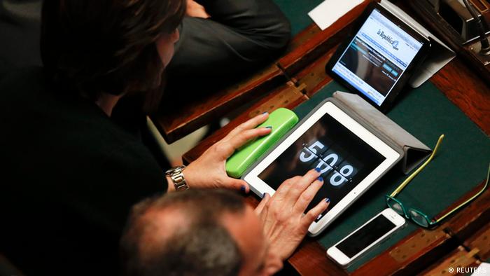 A parliamentary checks the online vote count during the presidential elections in the lower house of the parliament in Rome, April 18. (Photo: Reuters/Tony Gentile)