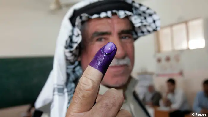 An internally displaced Iraqi man shows his ink-stained finger to the media after voting at a polling centre during the country's provincial elections in Kirkuk, 250 km (155 miles) north of Baghdad, April 20, 2013. Iraqis voted for provincial councils on Saturday in their first ballot since U.S. troops left the country, a key measure of political strength before parliamentary elections next year. Iraqi politics are deeply split along sectarian lines with Prime Minister Nuri al-Maliki's government mired in crisis over how to share power among Shi'ites, Sunni Muslims and ethnic Kurds who run their own autonomous region in the north. Violence and suicide bombings have surged since the start of the year with a local al-Qaeda wing vowing a campaign to stoke widespread confrontation among the country's combustible sectarian and ethnic mix. REUTERS/Ako Rasheed (IRAQ - Tags: POLITICS ELECTIONS TPX IMAGES OF THE DAY)