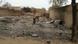 In this image shot with a mobile phone, a young girl stands amid the burned ruins of Baga, Nigeria, on Sunday, April 21, 2013. Fighting between Nigeria's military and Islamic extremists killed at least 185 people in a fishing community in the nation's far northeast, officials said Sunday, an attack that saw insurgents fire rocket-propelled grenades and soldiers spray machine-gun fire into neighborhoods filled with civilians.(AP Photo/Haruna Umar) pixel In this image shot with a mobile phone, a young girl stands amid the burned ruins of Baga, Nigeria, on Sunday, April 21, 2013. Fighting between Nigeria's military and Islamic extremists killed at least 185 people in a fishing community in the nation's far northeast, officials said Sunday, an attack that saw insurgents fire rocket-propelled grenades and soldiers spray machine-gun fire into neighborhoods filled with civilians.(AP Photo/Haruna Umar) pixel