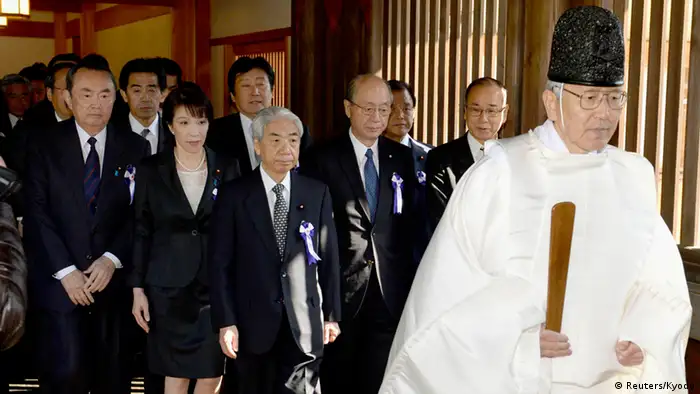 A group of lawmakers including Japan's ruling Liberal Democratic Party (LDP) lawmaker Hidehisa Otsuji (front 3rd L), Japan Restoration Party member Takeo Hiranuma (front L) and LDP member Sanae Takaichi (front 2nd L) are led by a shinto priest as they visit the Yasukuni Shrine in Tokyo, in this photo taken by Kyodo April 23, 2013. A nonpartisan group of 168 lawmakers visited the war-related Yasukuni Shrine on Tuesday, following visits by three Cabinet ministers and donations made by Prime Minister Shinzo Abe over the weekend, Kyodo news reported. Mandatory Credit. REUTERS/Kyodo (JAPAN - Tags: POLITICS RELIGION) ATTENTION EDITORS - FOR EDITORIAL USE ONLY. NOT FOR SALE FOR MARKETING OR ADVERTISING CAMPAIGNS. THIS IMAGE HAS BEEN SUPPLIED BY A THIRD PARTY. IT IS DISTRIBUTED, EXACTLY AS RECEIVED BY REUTERS, AS A SERVICE TO CLIENTS. MANDATORY CREDIT. JAPAN OUT. NO COMMERCIAL OR EDITORIAL SALES IN JAPAN. YES