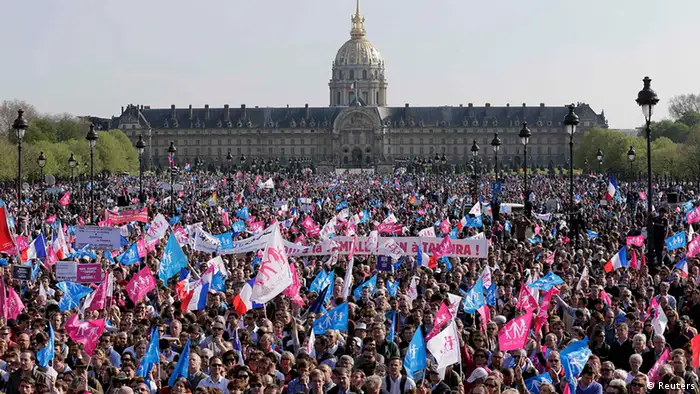 Thousands of gay marriage opponents wave pink, blue and white flags as they take part in the Manif pour Tous (Demonstration for All) protest march against France's planned legalisation of same-sex marriage near the Invalides in Paris, April 21, 2013. France's lower house of parliament prepares for a final vote on the law Tuesday, which will legalise gay marriage and give gay and lesbian couples adoption rights. REUTERS/Jacky Naegelen (FRANCE - Tags: CIVIL UNREST POLITICS SOCIETY)