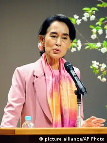 Nobel laureate and Myanmar opposition leader Aung San Suu Kyi gives a lecture at Kyoto University where she studied nearly three decades ago, in Kyoto, western Japan Monday, April 15, 2013. Suu Kyi is on a weeklong visit to Japan. (AP Photo/Kyodo News) JAPAN OUT, MANDATORY CREDIT, NO LICENSING IN CHINA, HONG KONG, JAPAN, SOUTH KOREA AND FRANCE