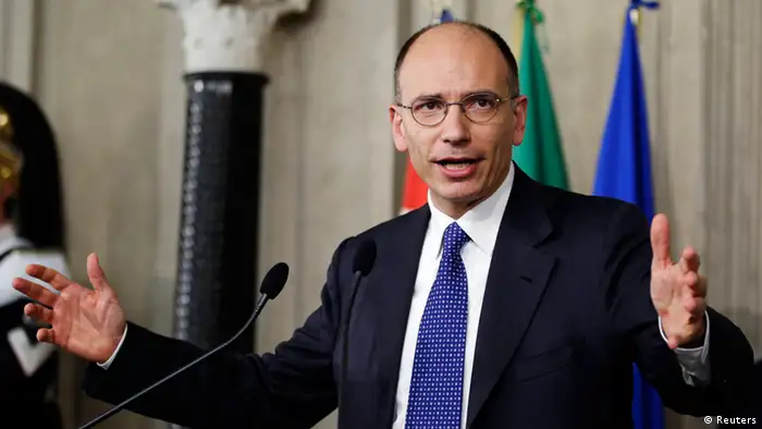 Deputy leader of Italy's centre-left Democratic Party (PD) Enrico Letta gestures as he speaks to reporters at the Quirinale Palace in Rome April 24, 2013. Italian President Giorgio Napolitano on Wednesday asked Letta to form a new government, signalling the end of a damaging two-month vacuum since elections in the euro zone's third largest economy in January. REUTERS/Max Rossi (ITALY - Tags: POLITICS ELECTIONS)
