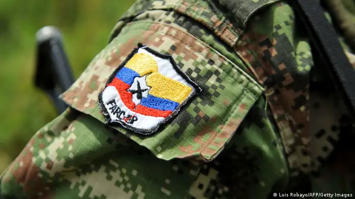 Picture of a badge on the arm of member of the Revolutionary Armed Forces of Colombia (FARC) guerrillas, taken while he guards the mountainous region of the department of Cauca, around Montealagre, Colombia, on February 15, 2013 after they released Colombian police officers Victor Alfonso Gonzalez and Cristian Camilo Yate. Leftist Colombian guerrillas on Friday released two police officers they had held for three weeks, the International Committee of the Red Cross said. The men were released in a rural area in Cauca department in southwestern Colombia and were in good health, the ICRC said in a statement. AFP PHOTO / LUIS ROBAYO (Photo credit should read LUIS ROBAYO/AFP/Getty Images)
