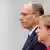 German Chancellor Angela Merkel and Italian Prime Minister Enrico Letta listen to their national anthems during a welcome ceremony outside the Chancellery in Berlin, April 30, 2013. REUTERS/Fabrizio Bensch (GERMANY - Tags: POLITICS)
