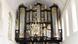 A church organ made of metal and wood painted black. A church organ made of metal and wood painted black.