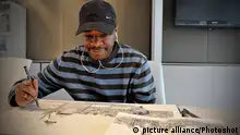 British Artist Stephen Wiltshire with his drawing of The Shard site by London Bridge. Wiltshire is able to draw landscapes accurately after brief observation. Part of The Big Draw, a campaign to get people more involved in drawing