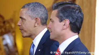 US President Barack Obama (L) and Mexican President Enrique Pena Nieto make their way to their seats for a bilateral meeting on May 2, 2013 at the Palacio Nacional in Mexico City. Obama landed in Mexico on Thursday at the start of a three-day trip that will also take him to Costa Rica, with trade, US immigration reform and the drug war high on the agenda. The runways of Mexico City's international airport closed for half an hour to let Air Force One land, and Obama was scheduled to head to the historic National Palace downtown for talks with Mexican President Enrique Pena Nieto. AFP PHOTO / Mandel NGAN (Photo credit should read MANDEL NGAN/AFP/Getty Images)