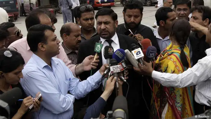 Prosecutor Chaudhry Zulfikar talks to journalists outside the anti-terrorism court (ATC) in Rawalpindi, in this file picture taken April 26, 2013. Zulfikar, the prosecutor investigating the 2007 assassination of former Pakistani Prime Minister Benazir Bhutto, one of the most shocking events in Pakistan's turbulent history, was shot dead on May 3, 2013, police sources said. Gunmen on a motorcycle pumped 12 bullets into Zulfikar as he left his home in Islamabad, the sources said. Picture taken April 26, 2013. REUTERS/Faisal Mahmood/Files (PAKISTAN - Tags: POLITICS CRIME LAW)