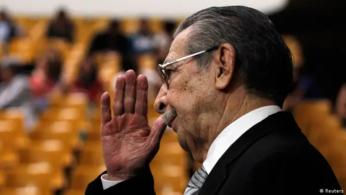 Former Guatemalan dictator Efrain Rios Montt salutes as he attends the restart of his genocide trial at the Supreme Court of Justice, in Guatemala City April 30, 2013. The trial has been up in the air after judges squabbled over who should hear the case following an order to annul nearly 18 months of proceedings. Rios Montt, 86, is charged with genocide and crimes against humanity for a counterinsurgency plan conceived under his 1982-1983 rule that killed 1,771 members of the Ixil indigenous group in one of the bloodiest phases of Guatemala's civil war. REUTERS/Jorge Dan Lopez (GUATEMALA - Tags: POLITICS CRIME LAW)