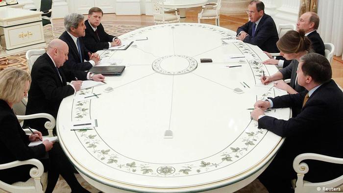 Russia's President Vladimir Putin (3rd R) listens to U.S. Secretary of State John Kerry (3rd L) during their meeting in Moscow, May 7, 2013. Kerry told Putin on Tuesday the United States and Russia share common interests in Syria, including promoting regional stability and preventing the spread of extremism. REUTERS/Maxim Shemetov (RUSSIA - Tags: POLITICS)