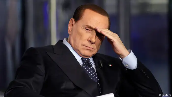 taly's former Prime Minister Silvio Berlusconi gestures as he appears as a guest on the RAI television show Porta a Porta (Door to Door) in Rome in this February 20, 2013 file photo. A Milan appeals court confirmed the sentencing of Berlusconi to 4 years in jail on May 8, 2013 for tax fraud in connection with the purchase of broadcasting rights by his television network Mediaset. REUTERS/Remo Casilli/Files (ITALY - Tags: POLITICS CRIME LAW)