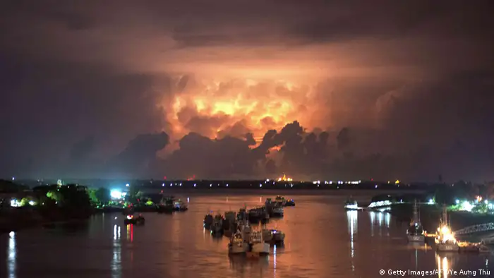 A storm lights up the sky above the Yangon river early on May 13, 2013. Myanmar on May 12 began moving people into emergency shelters as a cyclone threatened to batter a violence-wracked region home to tens of thousands of internal refugees. AFP PHOTO/ Ye Aung Thu (Photo credit should read Ye Aung Thu/AFP/Getty Images)