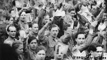 A Communist youth rally in East Berlin, Germany, 6th February 1950. They are waving the flag of the FDJ or Freie Deutsche Jugend, the Free German Youth. (Photo by FPG/Getty Images)