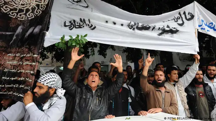 Tunisian Salafists hold banners and shout slogans as they rally in front of a court house in Tunis on November 6, 2012, to demand the release of people arrested in connection with an investigation into the attack on the United States embassy in Tunis on September 14, according to an AFP journalist. AFP PHOTO / FETHI BELAID (Photo credit should read FETHI BELAID/AFP/Getty Images)