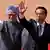 Chinese Premier Li Keqiang (R) and India's Prime Minister Manmohan Singh wave towards the media during Li's ceremonial reception at the forecourt of India's presidential palace Rashtrapati Bhavan in New Delhi May 20, 2013. Li arrived in New Delhi on Sunday for a three-day state visit. REUTERS/Adnan Abidi (INDIA - Tags: POLITICS)