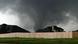 A tornado moves past homes in Moore, Okla. on Monday, May 20, 2013. (AP Photo/Alonzo Adams) A tornado moves past homes in Moore, Okla. on Monday, May 20, 2013. (AP Photo/Alonzo Adams)