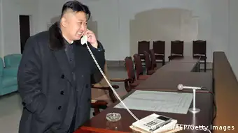 This picture taken by North Korea's official Korean Central News Agency (KCNA) on December 12, 2012 shows North Korean leader Kim Jong-Un celebrating the launch of the Unha-3 rocket, carrying the satellite Kwangmyongsong-3, at the general satellite control and command center in Pyongyang. Hundreds of thousands of North Korean soldiers and civilians rallied on December 14 in the centre of Pyongyang for a mass celebration of the country's long-range rocket launch, state television showed. AFP PHOTO / KCNA vis KNS ---EDITORS NOTE--- RESTRICTED TO EDITORIAL USE - MANDATORY CREDIT AFP PHOTO / KCNA VIA KNS - NO MARKETING NO ADVERTISING CAMPAIGNS - DISTRIBUTED AS A SERVICE TO CLIENTS (Photo credit should read KNS/AFP/Getty Images)